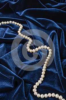 Pearls on blue velvet
