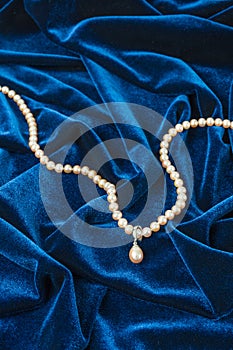 Pearls on blue velvet