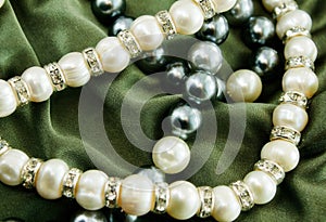 Pearls on green cloth