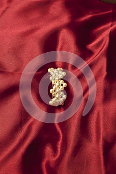 Pearls isolated on red