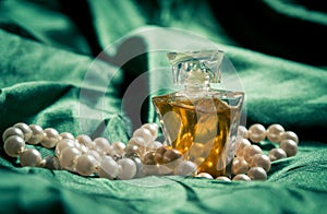 Pearls and perfume closeup