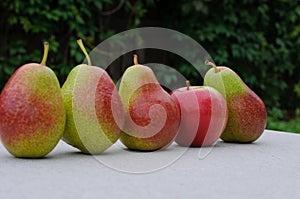 Pears and apple on the table