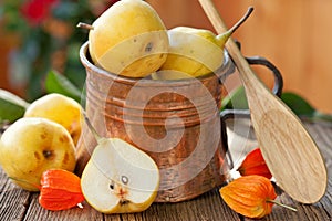 Pears in copper jug