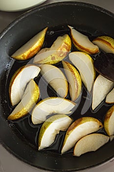 Pears fried on pan with hone