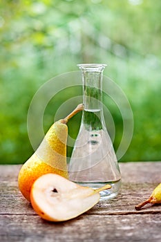 Pears and fruit brandy in bottle