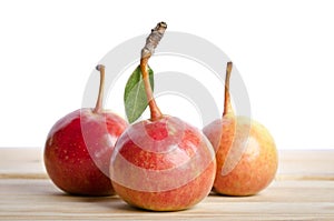 Pears in a grouping on wooden table