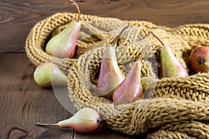 Pears on a rustic wooden kitchen table, selective focus. Autumn concept