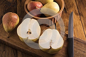 Pears sliced on a wooden board