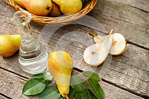 Pears on the table with glass bottle