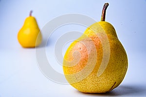 pears. Two whole yellow green pear fruits  on white with clipping path