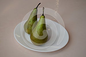 Pears  on a white plate. Still life.