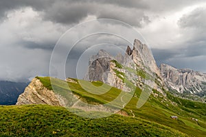 Pearson watching the incoming storm at the Seceda peak at the beautiful Val Gardena valley in Dolomites mountains, Alps, Italy