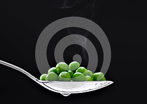 Peas in spoon