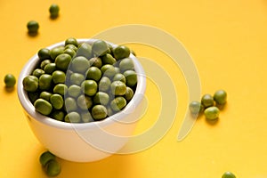 peas in a white bowl photo
