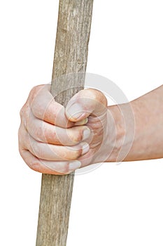 Peasant hand holds old wooden cudgel