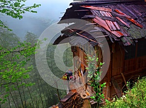 Peasant House with a wet roof, standing on brink o