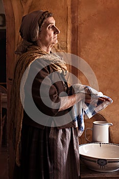 Peasant woman washing hands