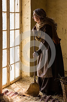 Peasant woman working in shed