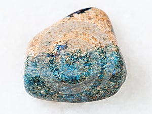 pebble of azurite stone on white