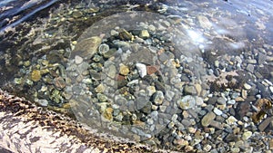 Pebble background under the sea water