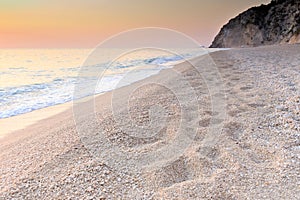 Pebble beach at dawn in Lefkada, Greece