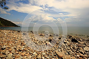 Pebble beach on the shore of lake Baikal