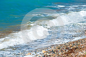 Pebble beach and small waves