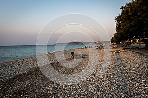 Pebble beach at sunset on the island of Rhodes