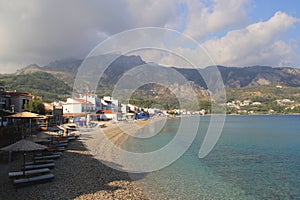 Pebble beach in the traditional Greek fishing village of Kokarri on the island of Samos