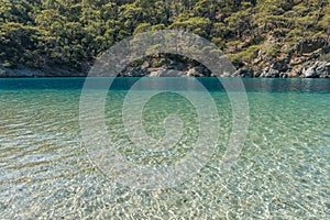 Pebble coast and waves in Oludeniz, Turkey. Blue Lagoon Fethiye, Mediterranean coast of Turkey