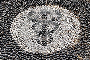 Pebble mosaic of the symbol of Hypocrates photo