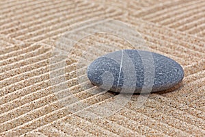 Pebble on raked sand squares