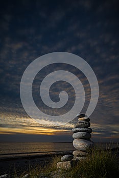 Pebble sculpture on a beach.