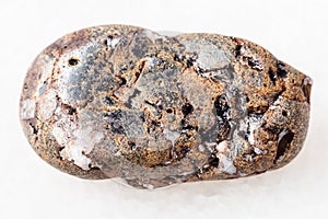 pebble of sphalerite stone with Galena on white