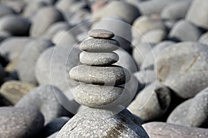 Pebble stack on the beach the stones represent balance and wellbeing of the mind