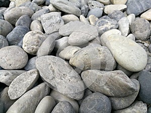 Pebble stone background,outdoor natural river white grey rock pebble,abstract dry garden round stones texture,Material for constru