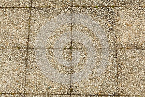 Pebble stone floor tile seamless background. Cement mixed gravel pebble stone floor texture. Wet round pebble stone rock floor in