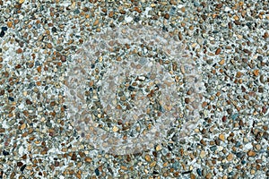 Pebble stone floor tile seamless background. Cement mixed gravel pebble stone floor texture. Wet round pebble stone rock floor in