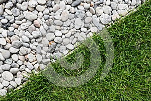 Pebble stone and green grass