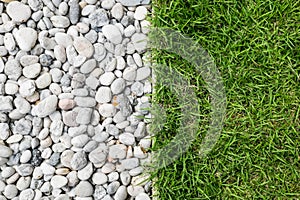 Pebble stone and green grass
