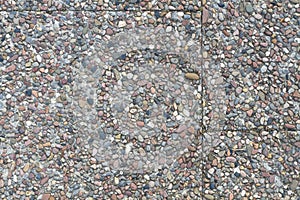 Pebble stone plates in cement on a sideway photo