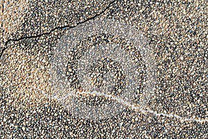 Pebble stone texture wall with cracked