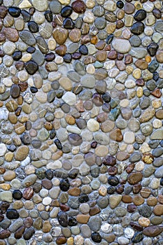 Pebble stone wall texture background or texture, close up