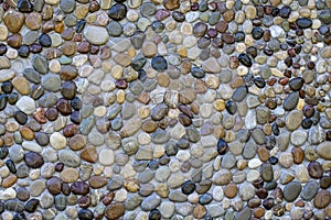 Pebble stone wall texture background or texture, close up