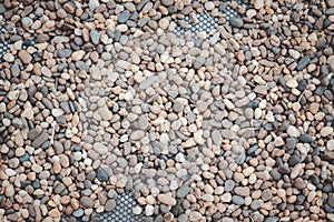 Pebble stones background placed on net decoration garden