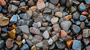 Pebble texture for background, small stones in varying shades, colored beach stones