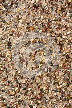 Pebble texture small stone on the building wall