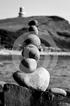 Pebble tower at beach symbolising stability, zen, harmony, balance