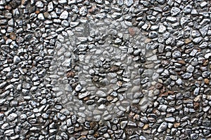 Pebble wall texture background painted with metallic gray paint
