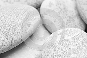 Pebbles background, abstract background with dry round gray reeble stones, gray close-up pebbles background, spa relaxation concep